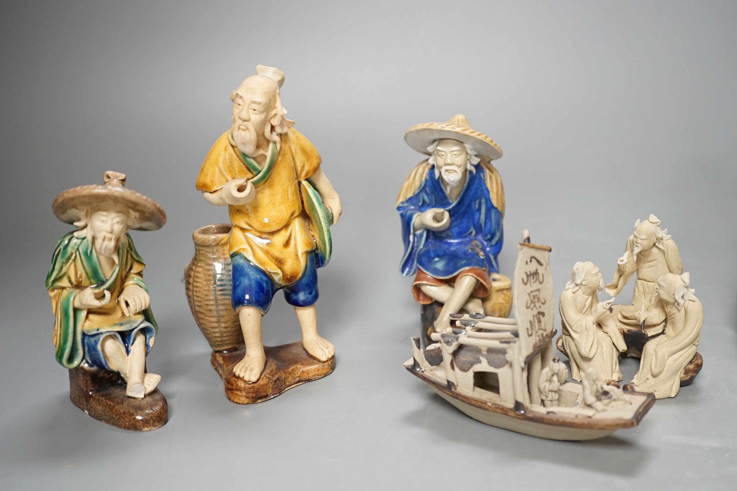 Five Chinese ceramic figures, saucers, etc., tallest 15cm. (18)